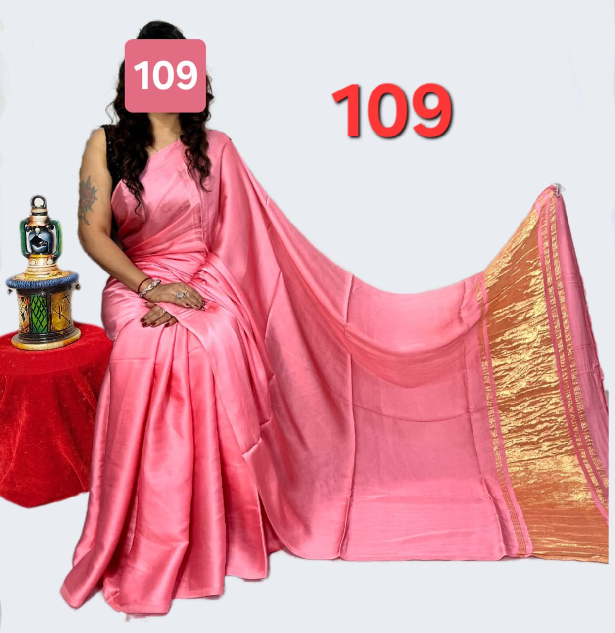 Baby Pink Satin Silk Saree with a Traditional Golden Zari Border.