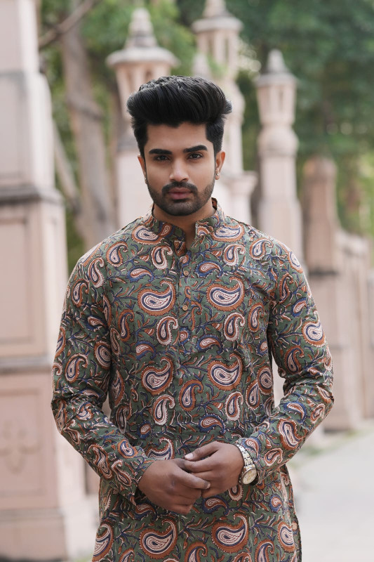 Olive green and brown with a paisley print or Kalamkari print pattern.