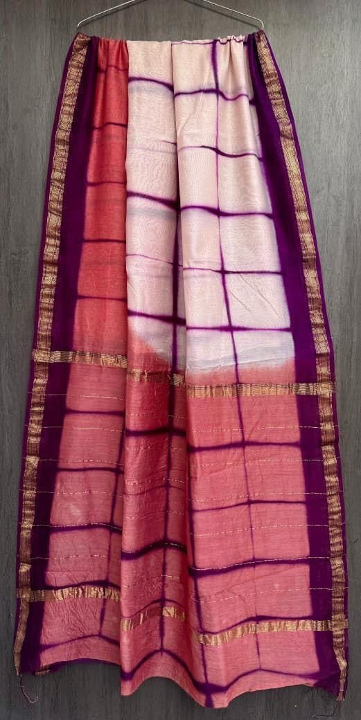 red, white, and purple tie-dye Maheshwari silk/cotton blend saree with a golden zari border.