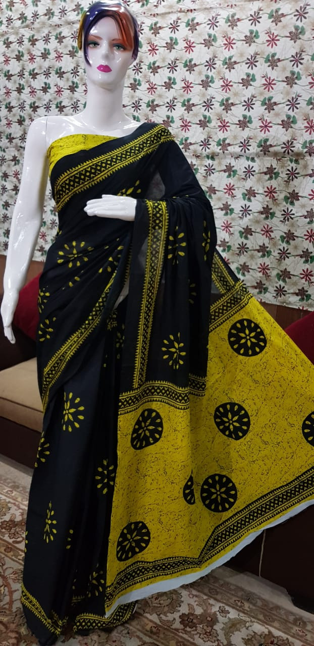 idnight Black Cotton Saree with Mustard Yellow Batik Sunburst Motifs and Intricate Tribal Borders.