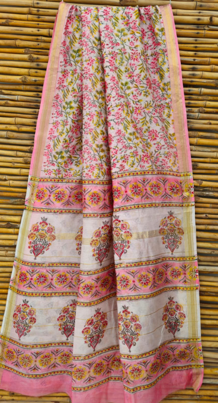cream and pink hand-block printed Maheshwari or Chanderi silk/cotton blend saree with traditional floral and paisley motifs and a golden zari border.