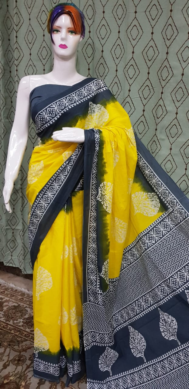 Vibrant Sun Yellow and Charcoal Grey Batik Saree with Leaf Motifs and Intricate Patterned Borders.