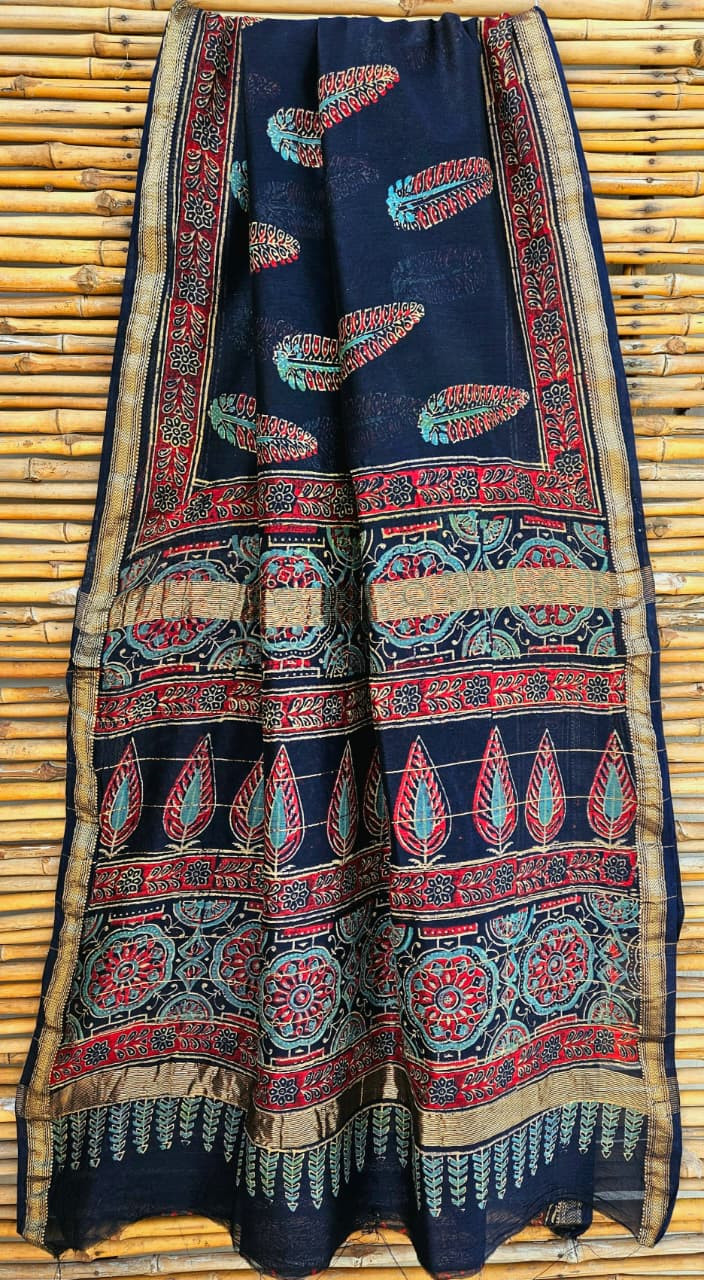 Hand block printed navy blue Maheshwari silk cotton blend saree with zari border.