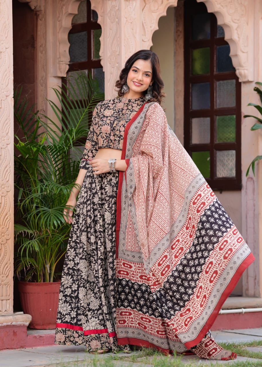 Black Cotton Floral Block Printed Lehenga Choli with a matching Beige and Maroon Printed Dupatta.