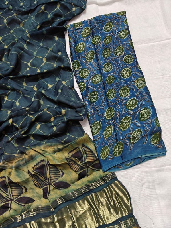 eal Blue Cotton Silk Blend Saree,Batik or Ajrakh Print and a Gold Zari Border.