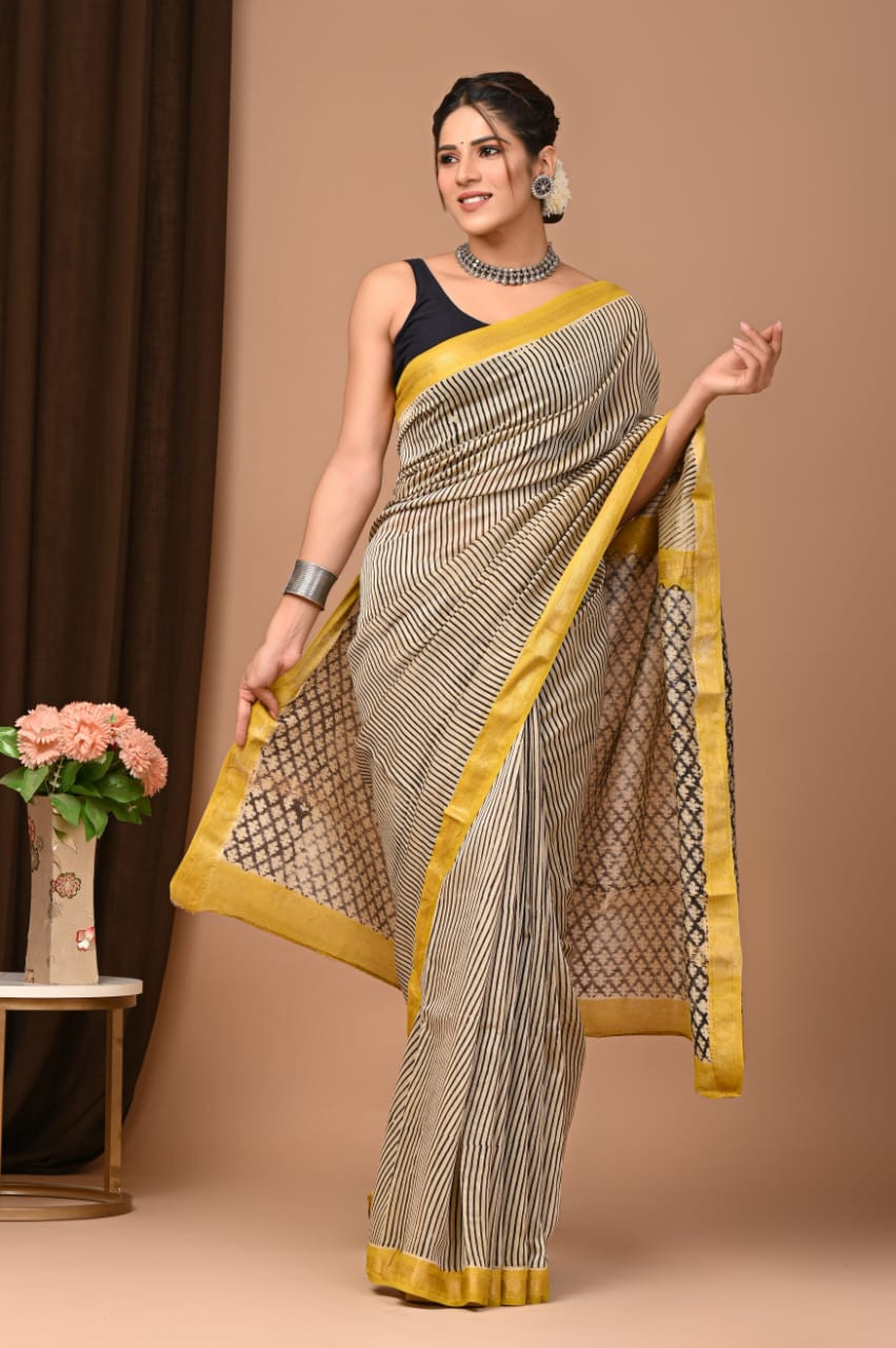 Black and White Maheshwari Silk Saree with a Yellow Border and Geometric/Striped Print.