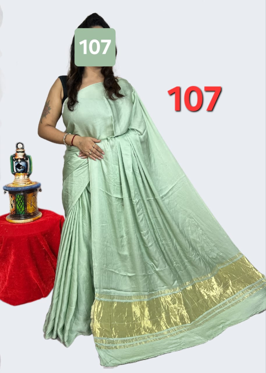 Mint Green Modal silk plain daying saree  with Elegant Gold Zari Border