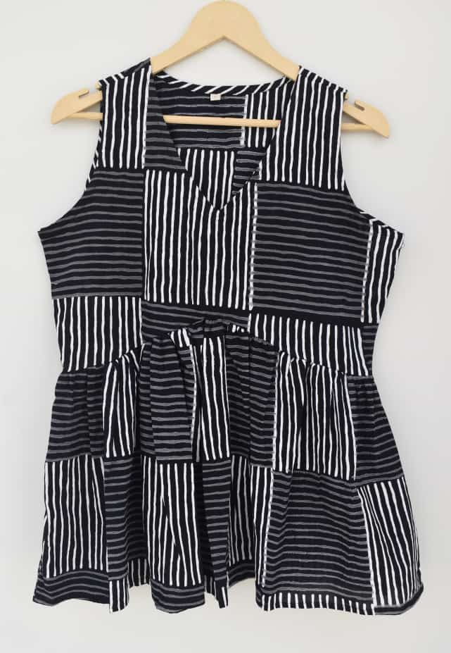 black and white striped patchwork peplum sleeveless top.