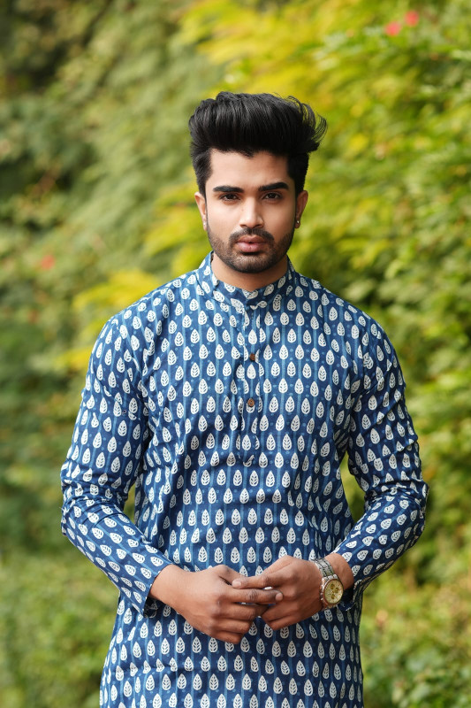 Indigo blue with a dabu print or hand block print pattern.