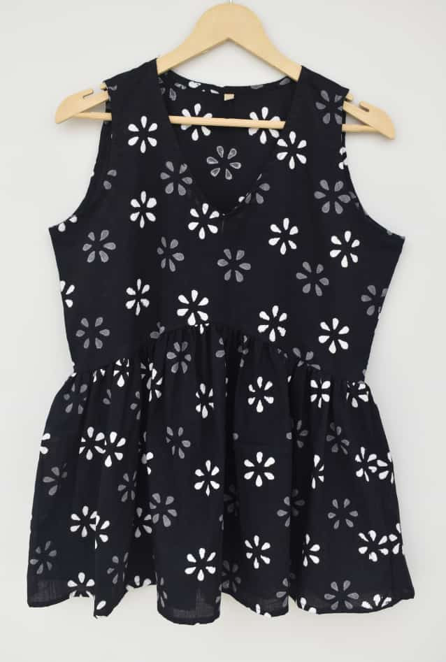 black, white, and gray floral print cotton sleeveless peplum top